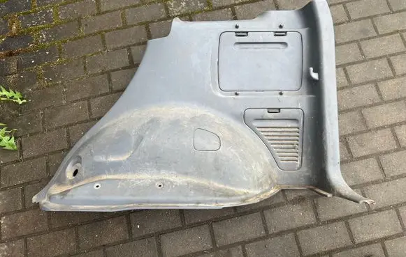 Trunk/boot lower side trim panel