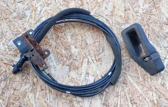 Subaru Outback Fuel cap flap release cable 57345AJ000