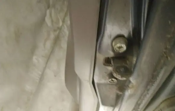 Front door check strap stopper