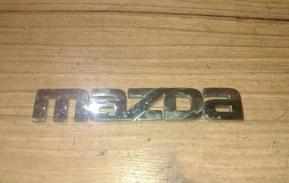 Mazda 323 F Manufacturer badge logo/emblem 