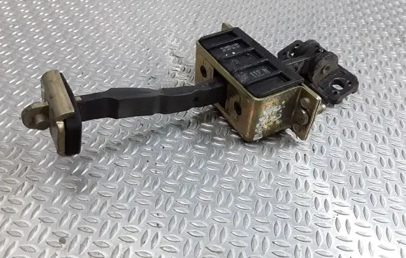Front door check strap stopper