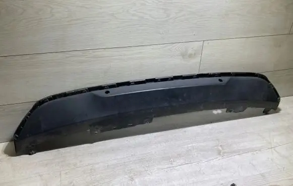Rear bumper trim bar molding