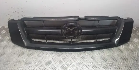 Mazda Tribute Front bumper upper radiator grill 5T248150