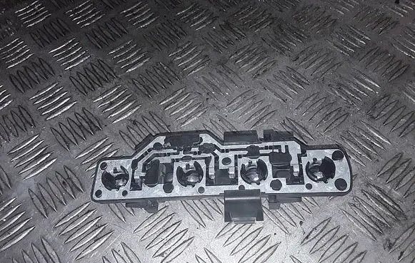 Tail light bulb cover holder
