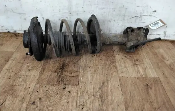 Nissan Maxima Front shock absorber with coil spring