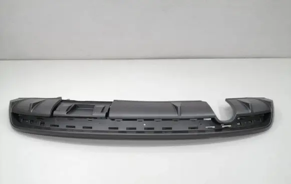 Rear bumper trim bar molding