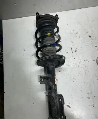 Front shock absorber with coil spring