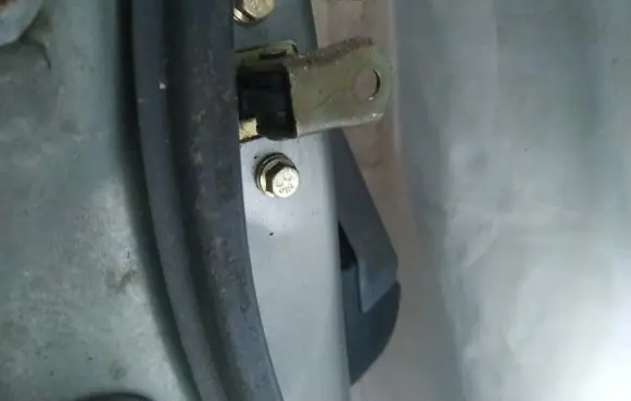 Front door check strap stopper