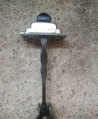 Front door check strap stopper
