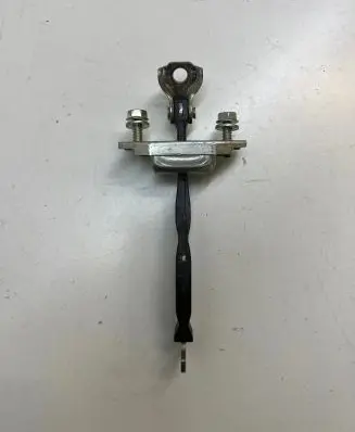 Front door check strap stopper