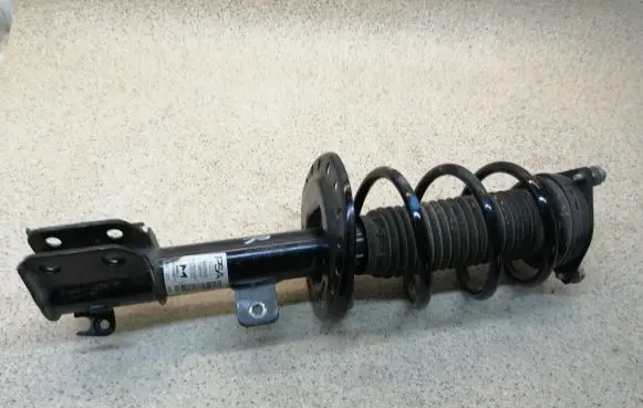 Opel Corsa F Front shock absorber with coil spring 9842159780 32001089