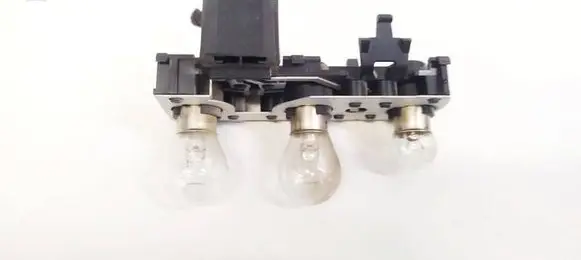 Tail light bulb cover holder