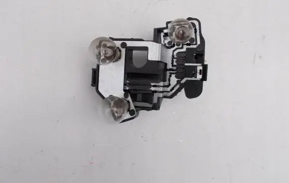 Tail light bulb cover holder
