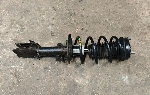 Ford Fiesta Front shock absorber with coil spring C1BC18K001BE C1BC18K001