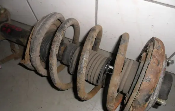 Nissan Primera Front shock absorber with coil spring