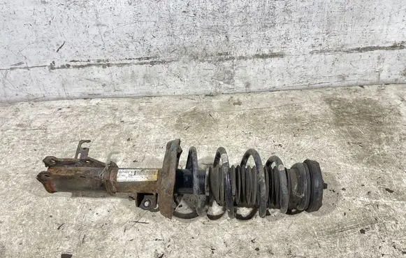 Opel Astra J Front shock absorber with coil spring 13412611