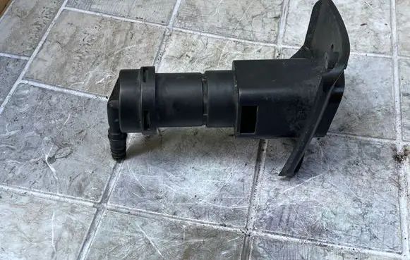 Chrysler Voyager Headlight washer spray nozzle