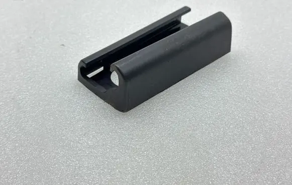 Tesla Model Y Front driver seat rail trim 164155600B