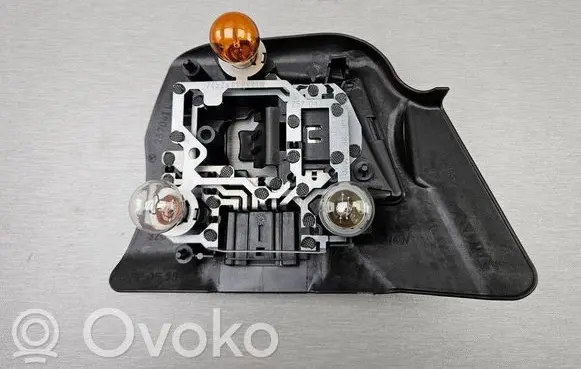 Tail light bulb cover holder