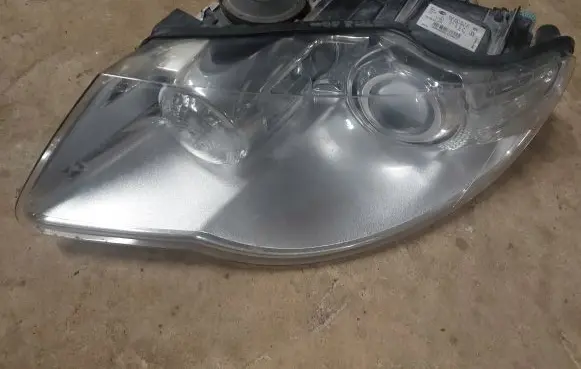 Volkswagen Touareg I Headlight/headlamp 7L6941031C