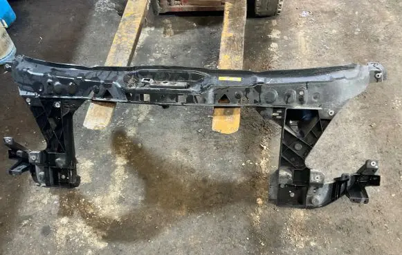 Top upper radiator support slam panel