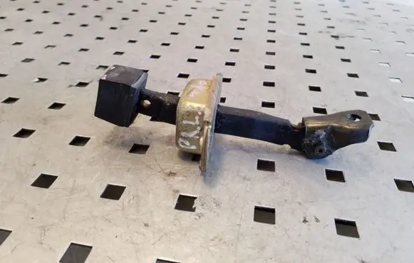 Front door check strap stopper
