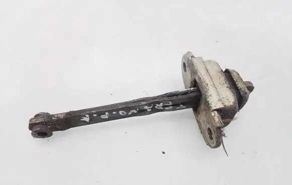 Front door check strap stopper