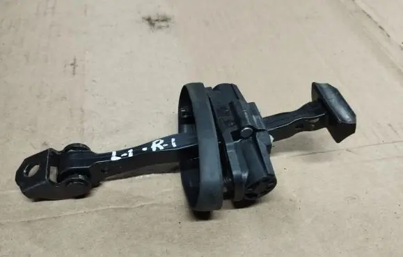 Front door check strap stopper