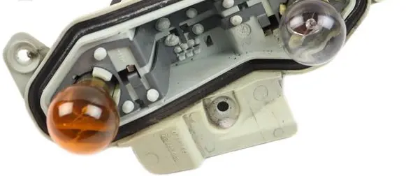 Tail light bulb cover holder