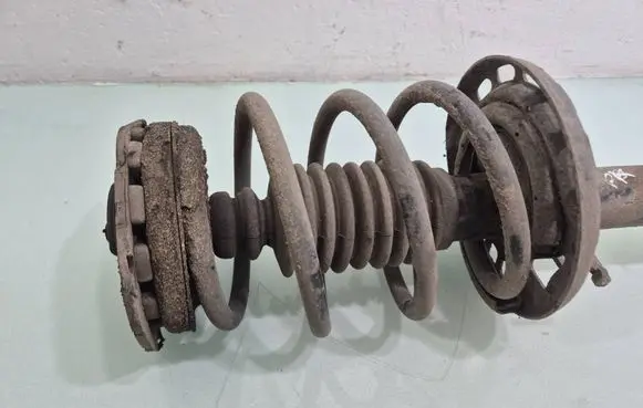 Renault Megane III Front shock absorber with coil spring 