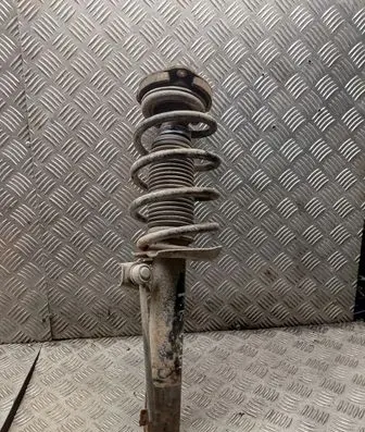 Volkswagen Caddy Front shock absorber with coil spring