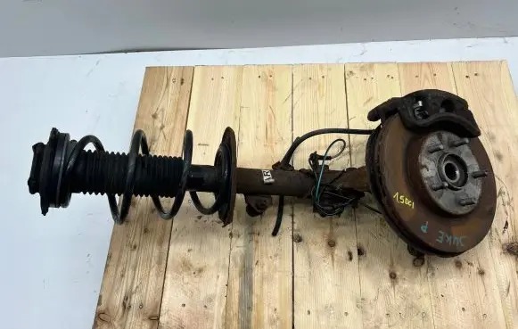 Nissan Juke I F15 Front shock absorber with coil spring