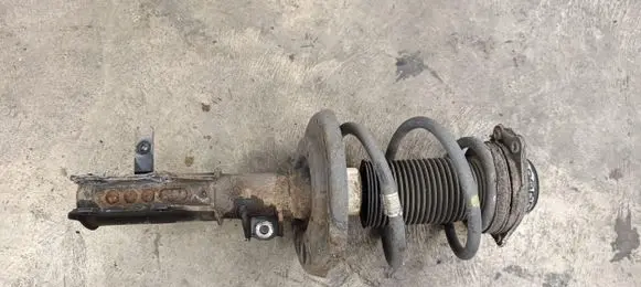 Front shock absorber with coil spring