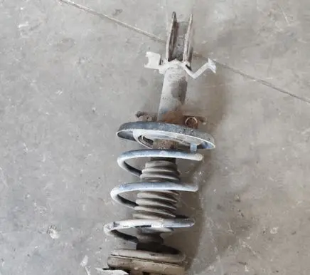 Renault Megane III Front shock absorber with coil spring