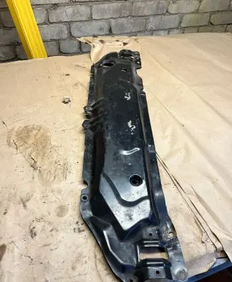 Top upper radiator support slam panel