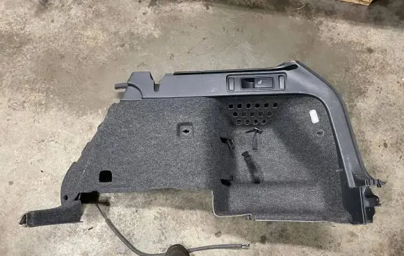 Trunk/boot lower side trim panel