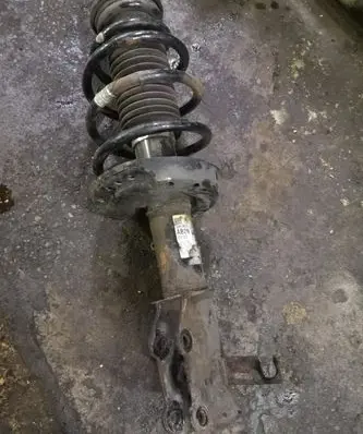 Opel Astra J Front shock absorber with coil spring 13412614