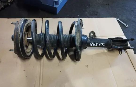 Front shock absorber with coil spring