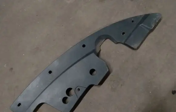 Engine bonnet/hood lock trim molding