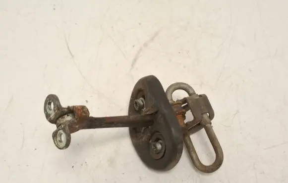 Front door check strap stopper