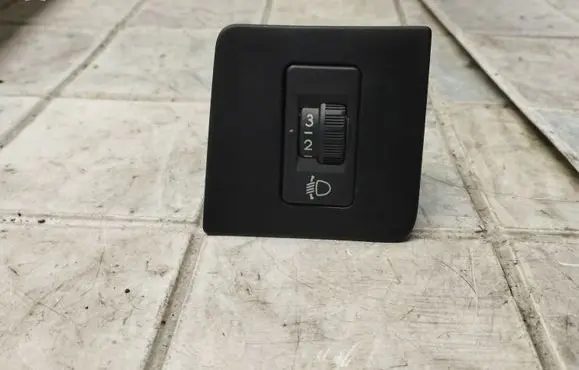 Headlight level height control switch