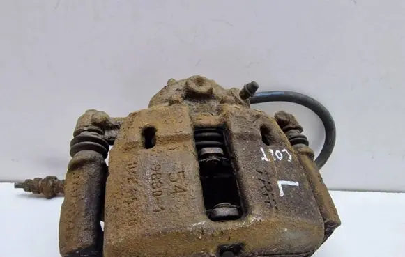 Mitsubishi Colt Front brake caliper 4605A065 323251545