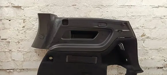 Trunk/boot lower side trim panel
