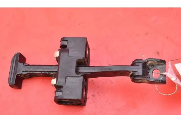 Front door check strap stopper
