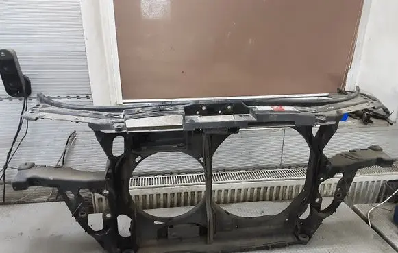 Radiator support slam panel