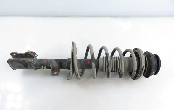 Suzuki Swift I Front shock absorber with coil spring 