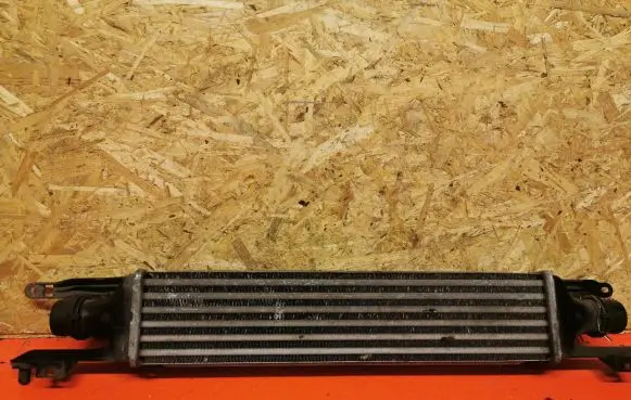 Opel Corsa D Intercooler radiator 55702004