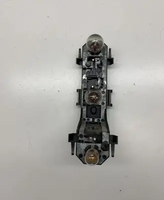 Tail light bulb cover holder