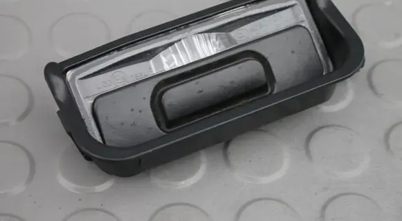 Trunk door license plate light bar