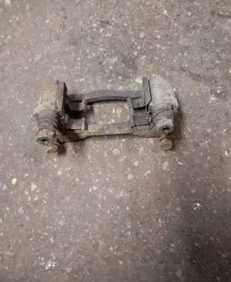 Subaru Legacy Brake caliper pad carrier rear 